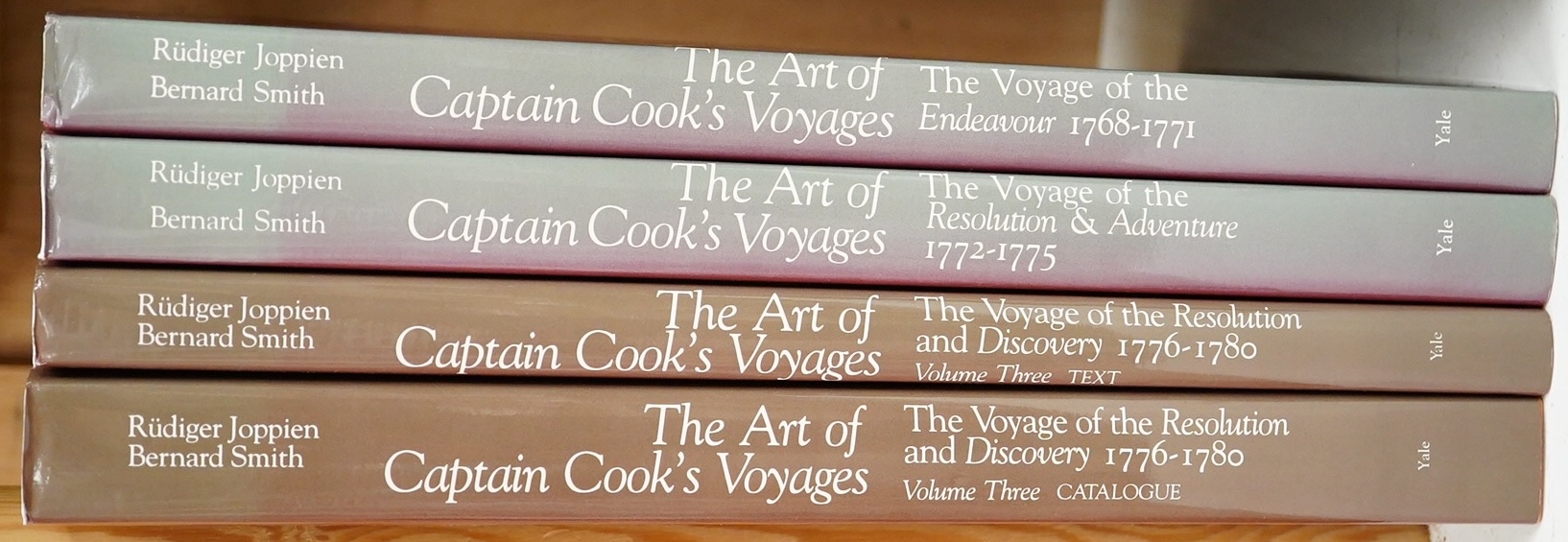 Joppien, Rudiger & Smith, Bernard - The Art of Captain Cook's Voyages ... 3 vols (in 4). illus. throughout (some full-page and coloured); publisher's cloth and d/wrappers, tall 4to. Yale University Press, 1985-88.